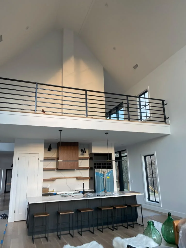 Finished open-plan interior with painted walls and tall ceilings